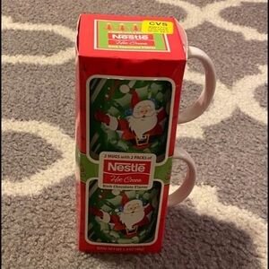 2 Christmas mugs with 2 packs of hot chocolate